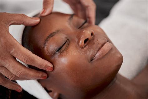 Black Woman Relax Face And Luxury Spa Massage Of A Young Female Ready For Facial Skincare