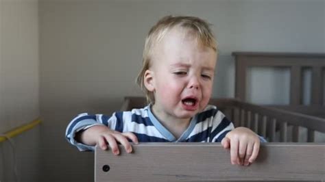 Crying Baby Boy In Crib At Home — Stock Video © 371819 189923336