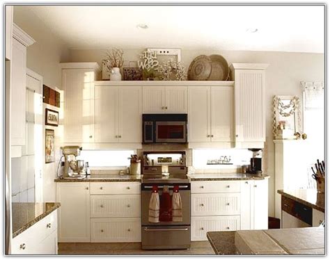 Your kitchen cabinets are a great place to refresh the look and decor of your kitchen. Decorate Top Kitchen Cabinets | Home Design Ideas ...