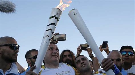 olympic torch handed over to brazilians bbc news