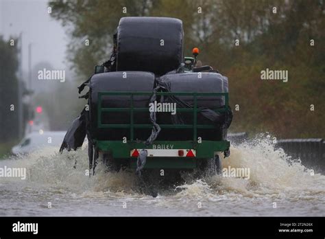 A Tractor Drives Through The Flooded Barnsdale Road In Leeds After The