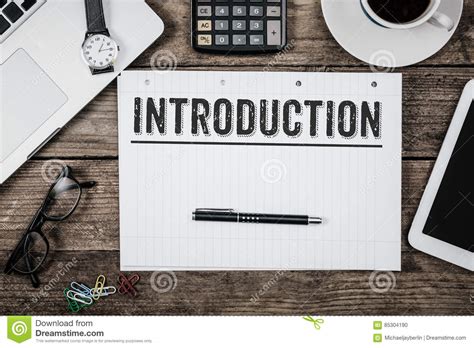 Introduction Text On Note Pad, Office Desk With Computer Technology ...