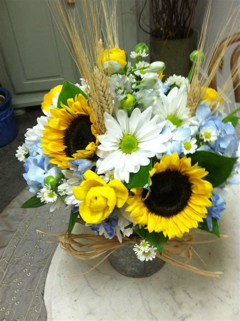 Blue daisy floral & design's headquarters is in arlington heights, illinois. Sunflowers hydrangea white daisy centerpiece | Farm party ...