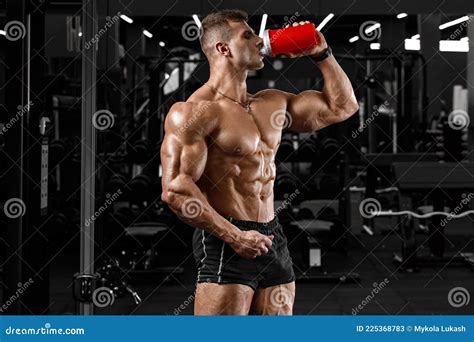 Muscular Man Drinking Water In Gym Strong Male Naked Torso Abs