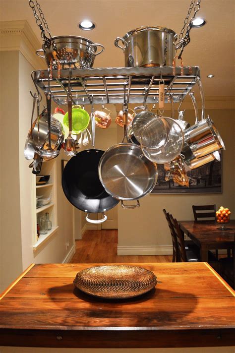 Hold the shoe rack upside down on the ceiling and mark where you want the pot hanger to hang from the ceiling. This one-of-a-kind modern hanging pot rack is made from ...