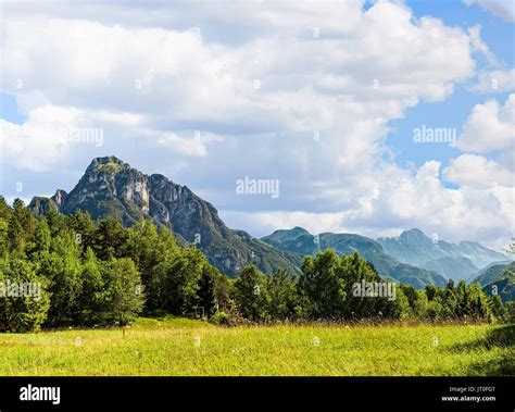 Idyllic Landscape In The Alps With Fresh Green Meadows Stock Photo Alamy