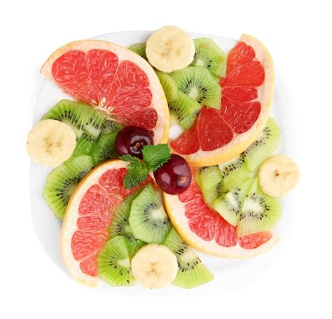 Premium Photo Assortment Of Sliced Fruits On Plate Isolated On White