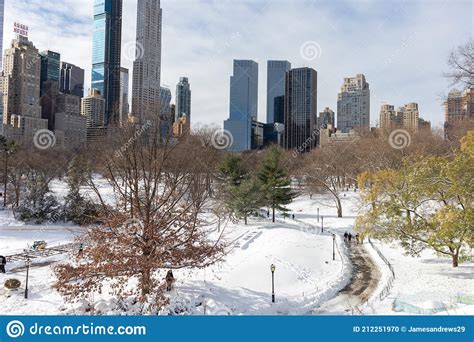Beautiful Central Park Covered In Snow With Skyscrapers In New York