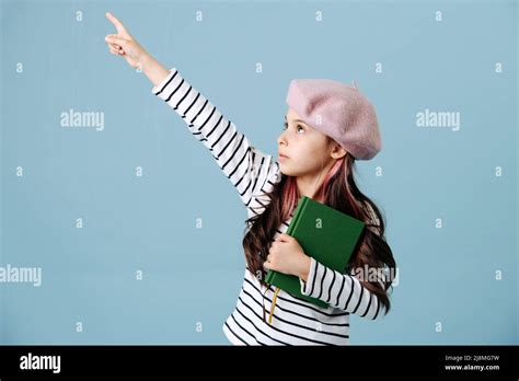 Pointing With Her Finger Tween Girl In French Beret Posing Over Blue Background She Has Dyed