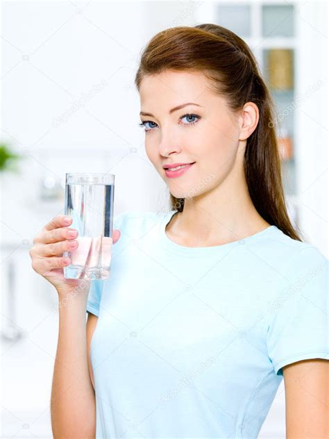 Woman Holds A Glass With Water — Stock Photo © Valuavitaly 4036647