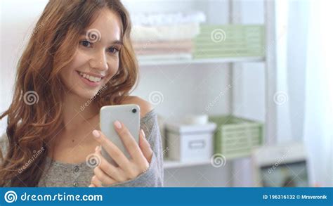 Smiling Woman Taking Mobile Selfie Photo On Phone At