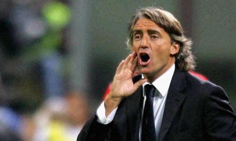 Roberto mancini and his very bronzed wife make a splash in sardinia. star sport: ROBERTO MANCINI BIOGRAPHY
