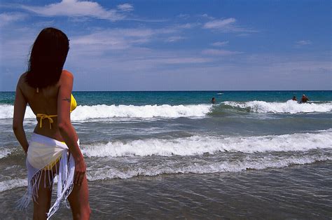 Woman In A Bikini Watching The Surf License Image Lookphotos