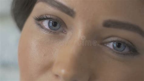 Extreme Close Up Portrait Of Pretty Woman Looking At Camera Stock