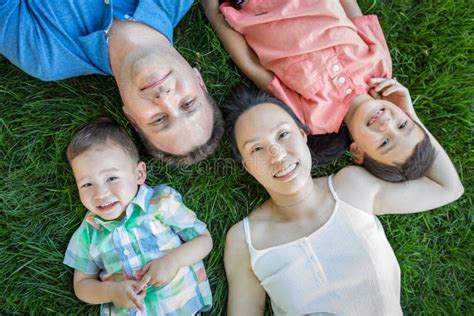 Chinese Mother Caucasian Father And Mixed Race Children Laying On
