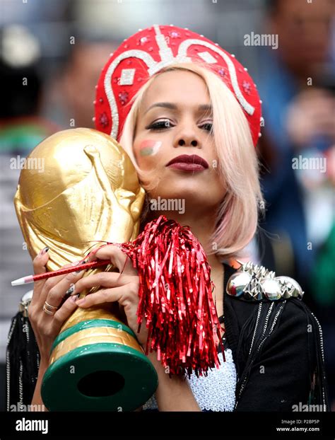 a russia fan in the stands with a replica world cup trophy ahead of the fifa world cup 2018