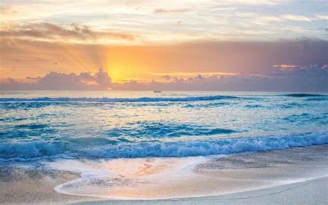 Beautiful Ocean Waves Beach Sand During Sunset Under White Yellow