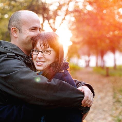 Loving Couple Embracing In The Park Stock Photo Image Of Embrace