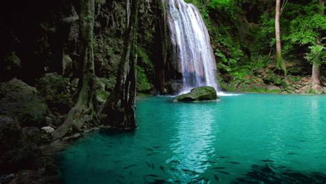 Tranquil And Serene Scene Of Waterfall Falling In Wild Pond In Jungle Rainforest Of Asia Stock