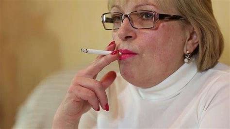 A Senior Woman Hand With Cigarette Female Smoker Close Up Shot