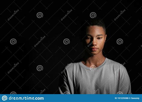 Sad African American Teenage Boy On Dark Background Stock Photo Image