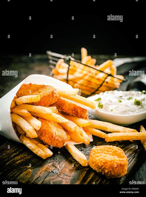 Deep Fried Takeaway Crumbed Fish Portions And Golden Potato Chips