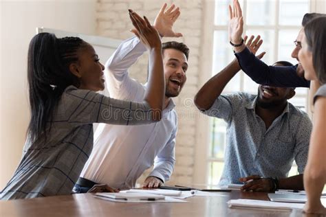 Multiracial Euphoric Business Team People Give High Five Office Stock