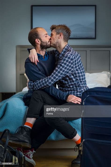 Gay Couple Kissing In A Hotel Room Photo Getty Images