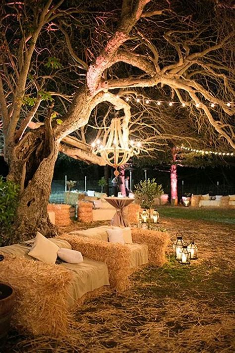The lights and flowers really give it a romantic look. 30 Rustic Outdoor Wedding Decorations with Hay Bales ...