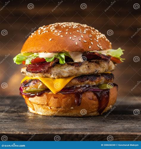 Big Grilled Chicken Burger With Double Cutlet And Cheese On Wooden