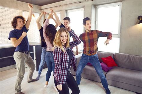 Friends Dance At A Student S Party In The Apartment Stock Photo
