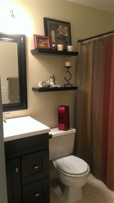 Mount the towel bar on a door. Small bathroom with earth tone color scheme ...