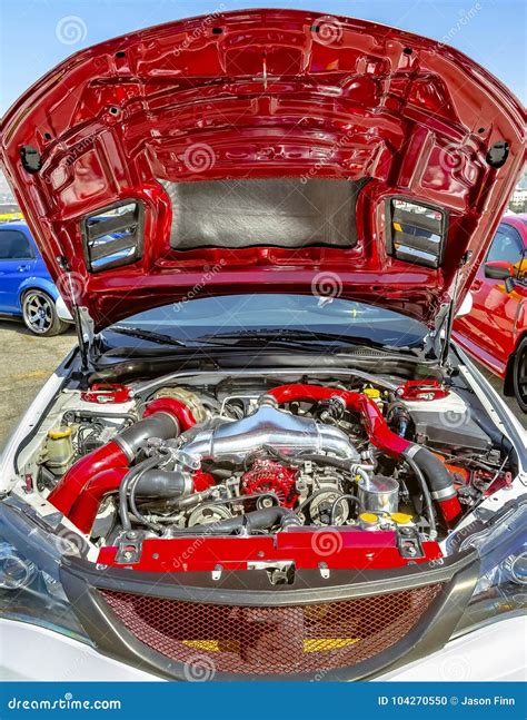 Wide Open Hood With Colorful Red Parts Under The Hood Stock Photo