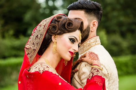 A nice tuxedo and wedding dress from their partner companies (including dress fitting) hair styling: Asian Wedding Photography London - Red and Gold Weddings
