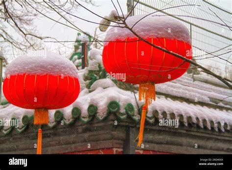 Explore the allure of traditional lanterns in a sunlit Chinese street