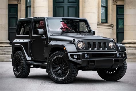 Download A Black Jeep Parked In Front Of A Building