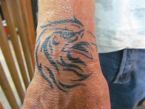 tribal eagle wrist tattoo | Wrist tattoos, Cool wrist tattoos, Wrist tattoos for women