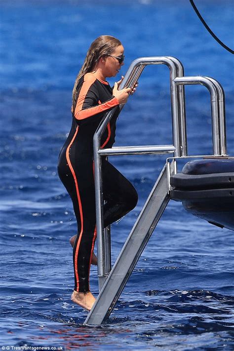 Mariah Carey Flashes Cleavage In Body Hugging Wetsuit With James Packer Daily Mail Online