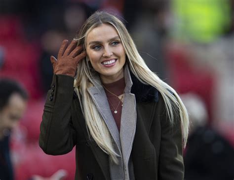 She is a british singer and songwriter. PERRIE EDWARDS at Anfield in Liverpool 12/29/2019 - HawtCelebs