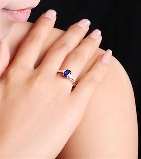 Trilogy Half Carat Oval Cut Sapphire And Round Diamond Engagement Ring