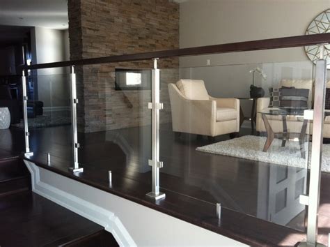 Need help with pony walls/sunken living room from st.hzcdn.com. Glass Railing - Modern - Living Room - other metro - by Spanish Ornamental Ltd