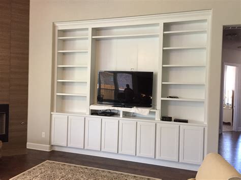 We even included a section for hanging clothes. Jaimes Custom Cabinets | Custom Built-Ins