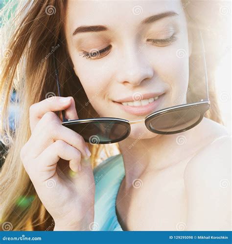 Beautiful Young Girl With Sunglasses Smiling On Sunny Street Stock