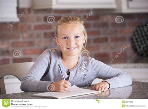 Cute Little Girl Studying And Writing Stock Images Image
