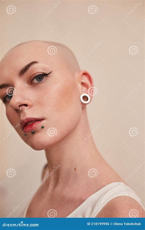 Bald Masculine Woman Posing Fashionably With Serious Emotions Stock