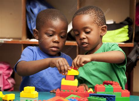 Two Children Playing With Building Blocks Stock Image F0337409