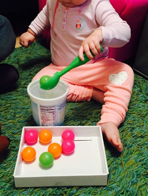 Free delivery on orders over £40. Fine Motor: Transferring with balls, a container, and an ...