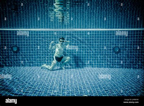 Man Posing As Superman Underwater Swimming Pool Stock Photo Alamy