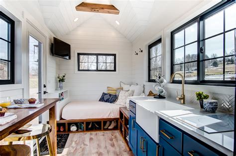 This tiny home features an open floor plan with tons of natural light coming in thanks to 8 large windows on just one side of the home and a couple more on the surrounding sides, even a 7' x 7' huge window in the kitchen! Gallery - Modern Tiny Living