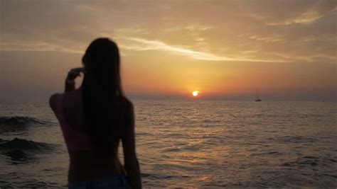 Woman Feeling Lonely Looking Sun Going Down In The Ocean Stock Footage